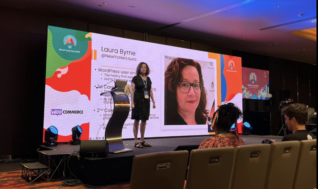 Laura speaking on stage at WordCamp Asia 2023